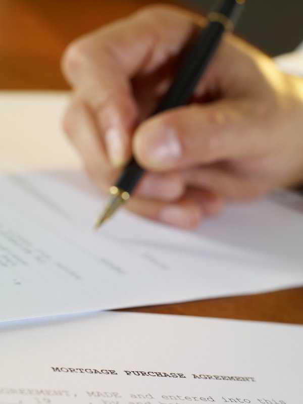 Signing-a-mortgage-document-4-30-14.jpg